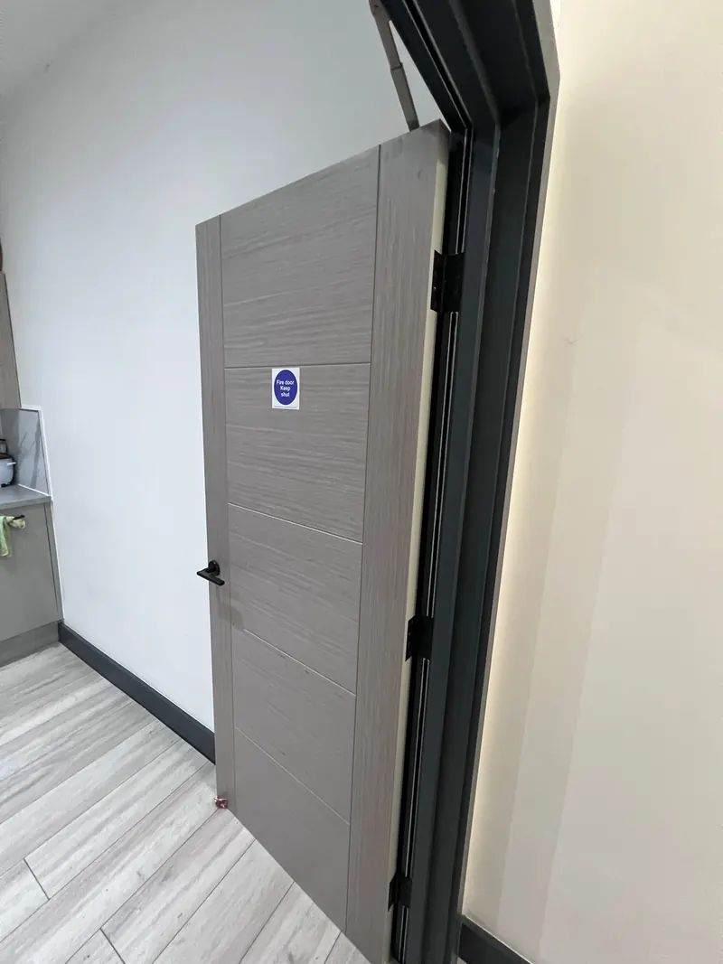 Fire door hardware and closer being checked