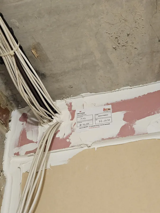 Cables through a fire batt seal, labelled