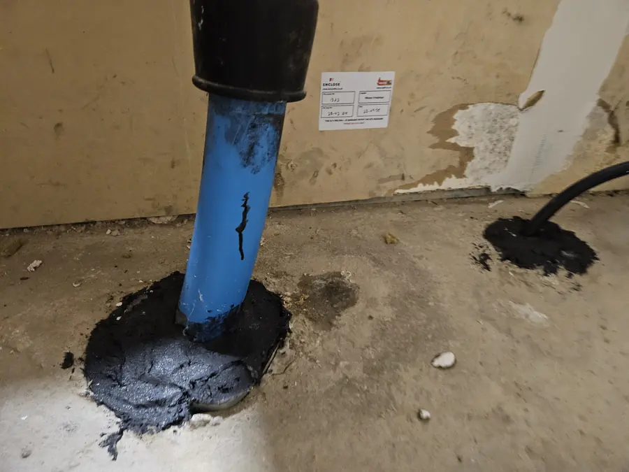 Pipe sealed with fire mastic and labelled